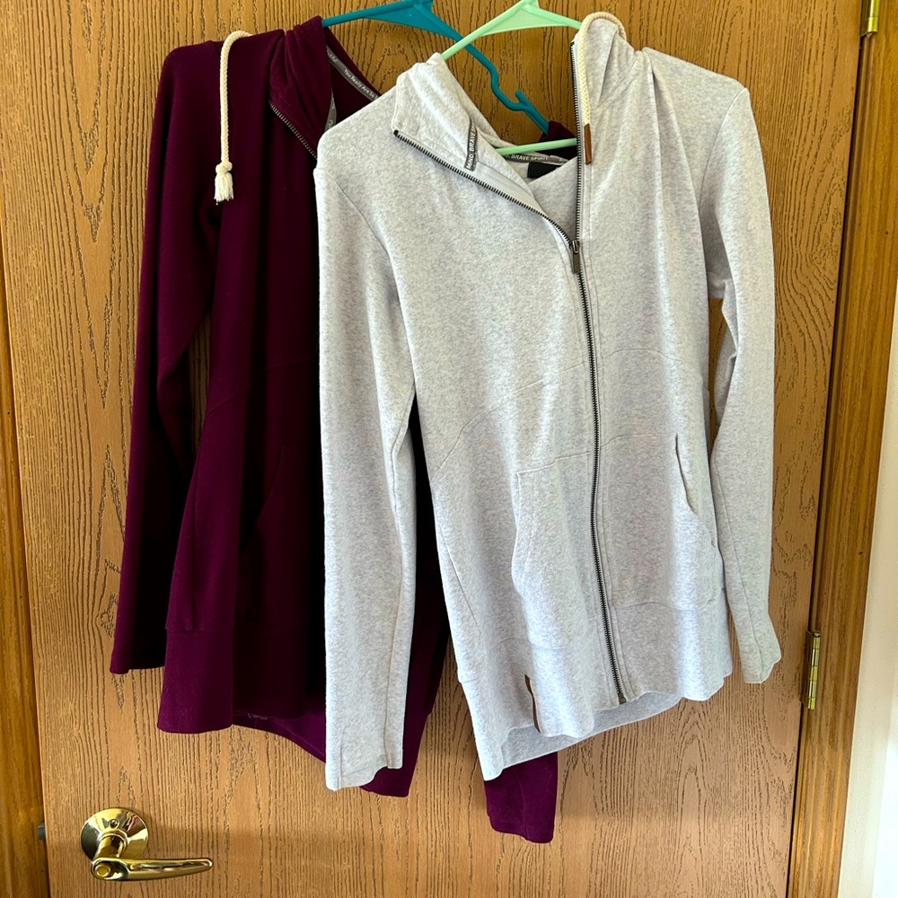 Two full zip boutique hoodies.